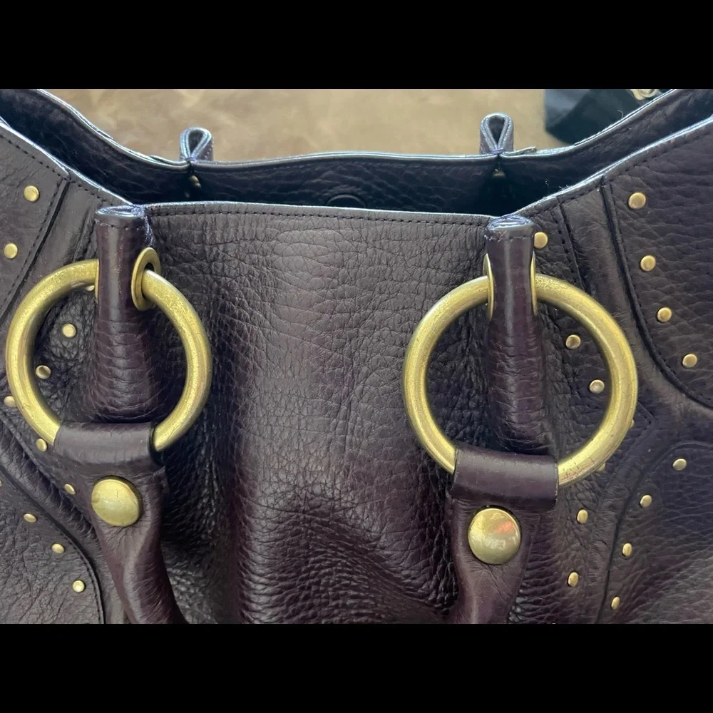 Kenneth Cole Purple Thick
Pebble Leather Studs Satchel Handbag
Purse PRE-OWNED - Picture 6 of 11